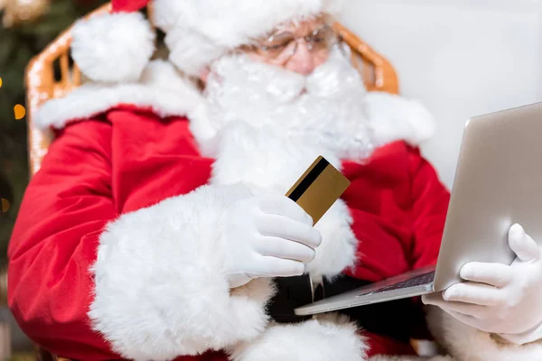 Santa claus shopping online — Stock Photo