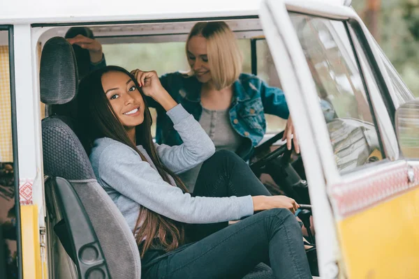 Multiethnic girls in minivan — Stock Photo