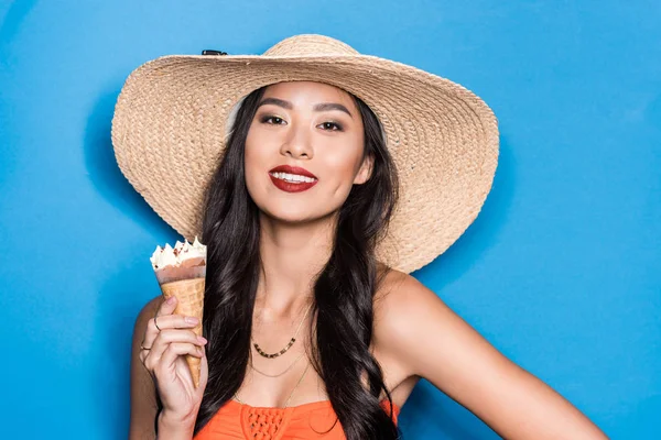 Asian woman holding ice-cream — Stock Photo
