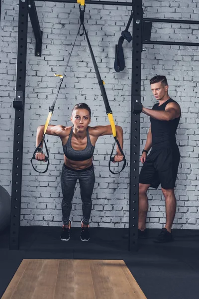 Woman exercising with resistance bands — Stock Photo