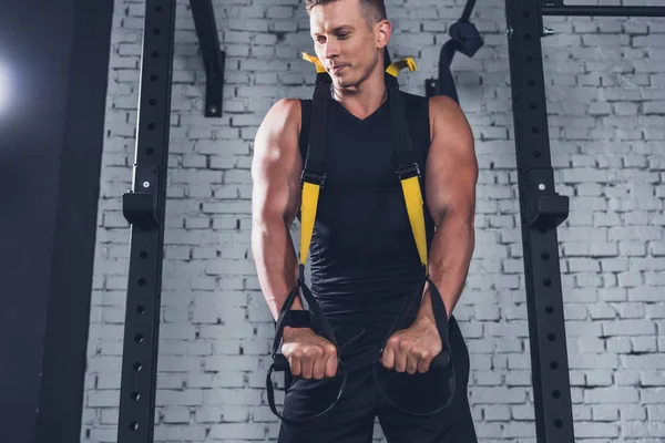 Man exercising with resistance bands — Stock Photo