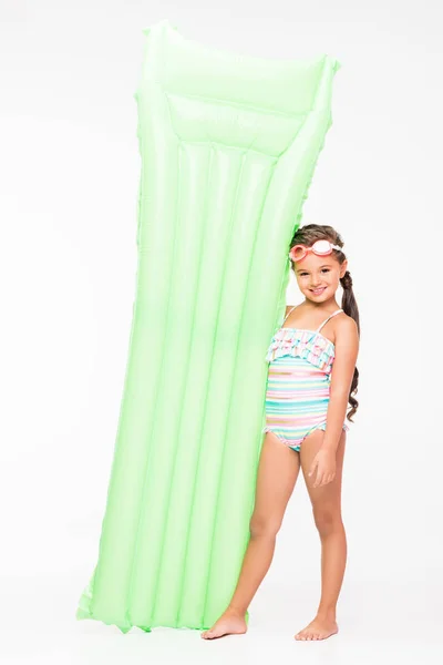 Child holding swimming mattress — Stock Photo