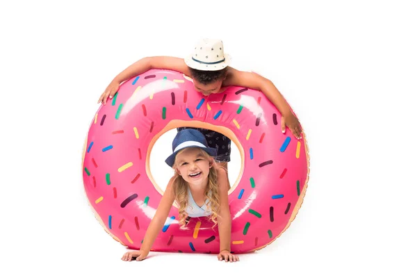 Multiethnic kids with swim tube — Stock Photo