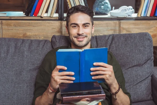 Handsome student reading books — Stock Photo