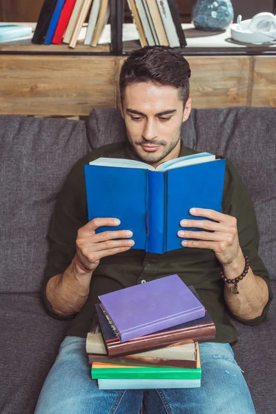 Handsome student reading books — Stock Photo