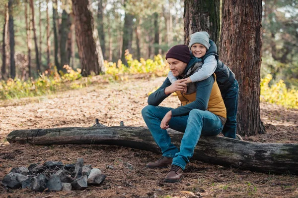 Father and son hugging in forest — Stock Photo