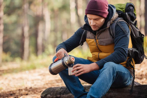 Man drinking tea in forest — Stock Photo
