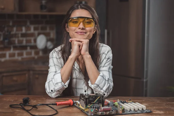 Woman with computer motherboard — Stock Photo