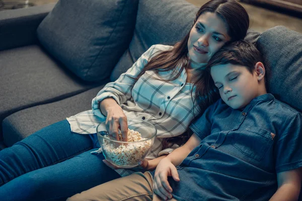 Family watching movie and falling asleep — Stock Photo