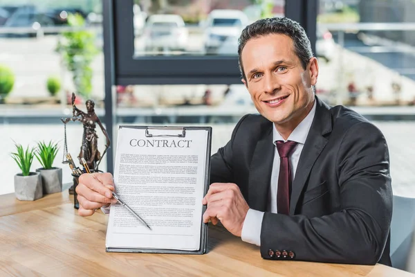 Lawyer pointing at contract — Stock Photo