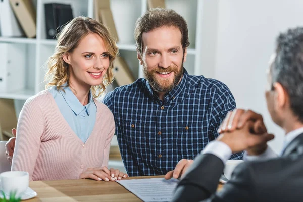 Couple discussing contract with lawyer — Stock Photo