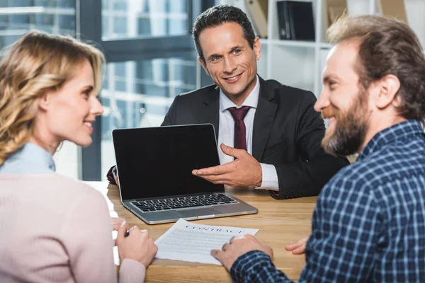 Lawyer pointing at laptop — Stock Photo