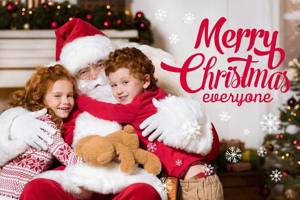 Santa claus and little siblings — Stock Photo