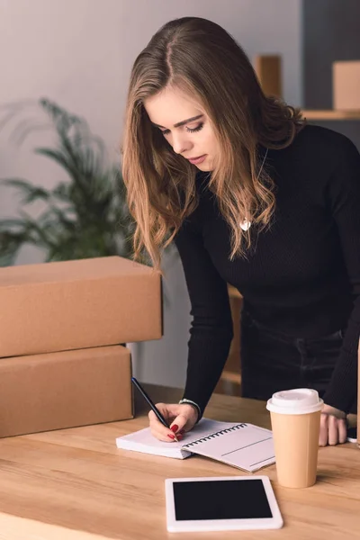 Portrait of attractive entrepreneur working at home office — Stock Photo