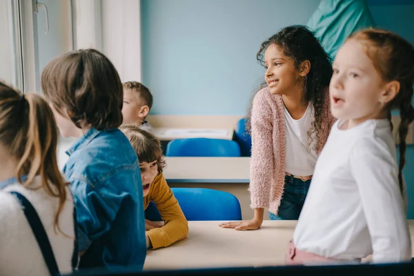 Group of kids spending time together at classroom — Stock Photo