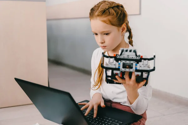 Beautiful concentrated child programming diy robot, stem education concept — Stock Photo