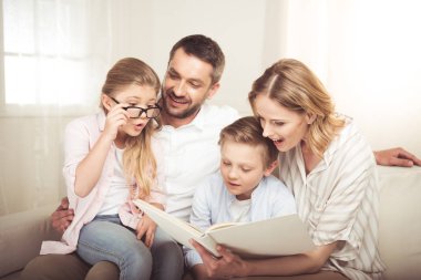 Happy family reading  clipart
