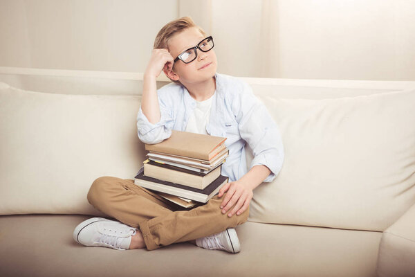 Little boy with books 