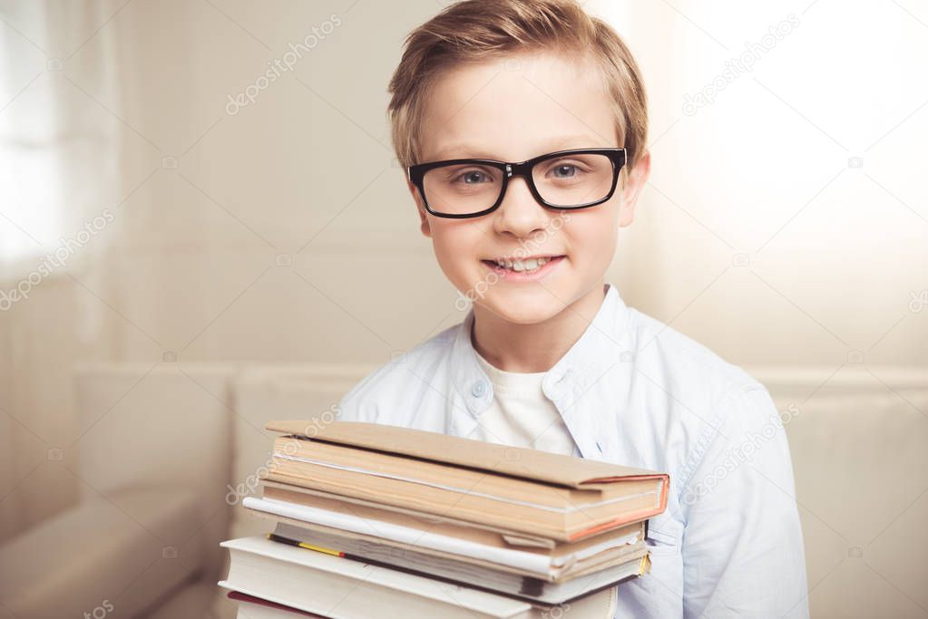 Little boy with books 