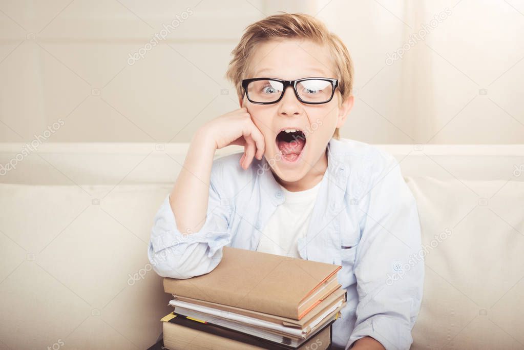 Little boy with books 