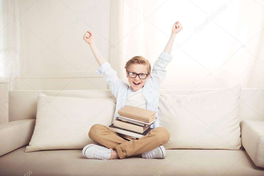 Little boy with books 