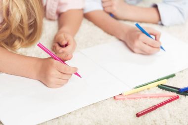 kids writing with felt pens on paper clipart