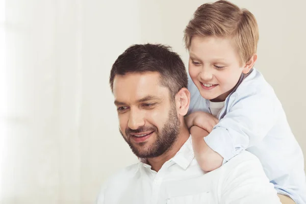 Son with father spending time at home — Stock Photo, Image
