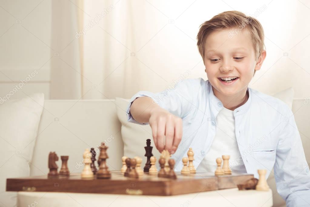 little boy playing chess