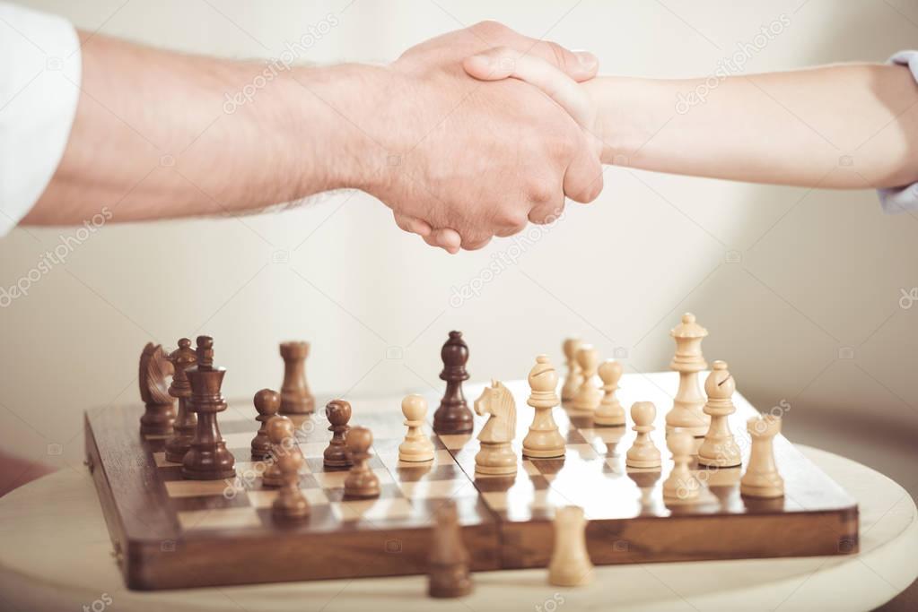 father and son shaking hands