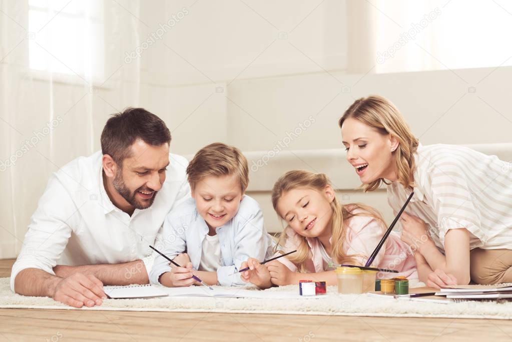 happy family drawing pictures at home