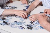 family playing with puzzle 