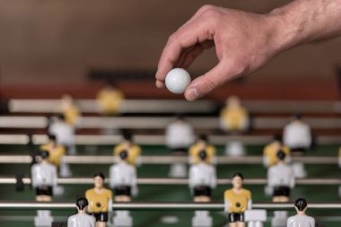foosball and hand with ball clipart