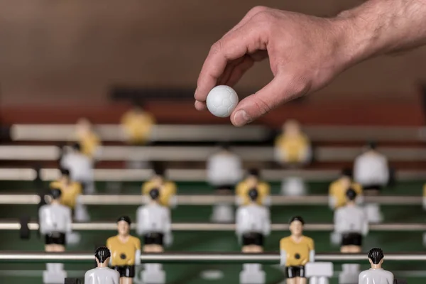 Foosball and hand with ball — Stock Photo, Image