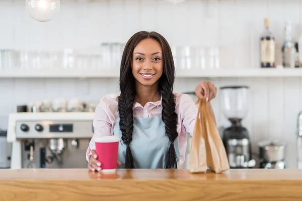 Waitress with take away order — Stock Photo, Image