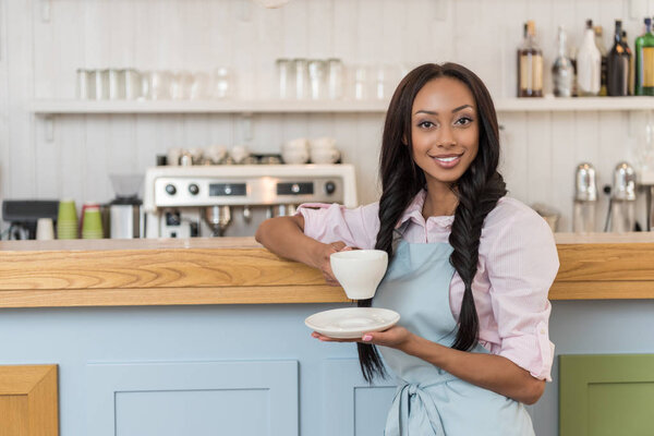 waitress with coffee at cafe