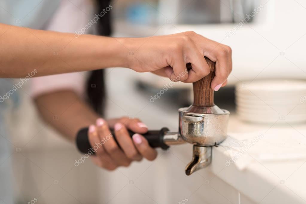 Barista making coffee