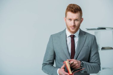 handsome businessman with book