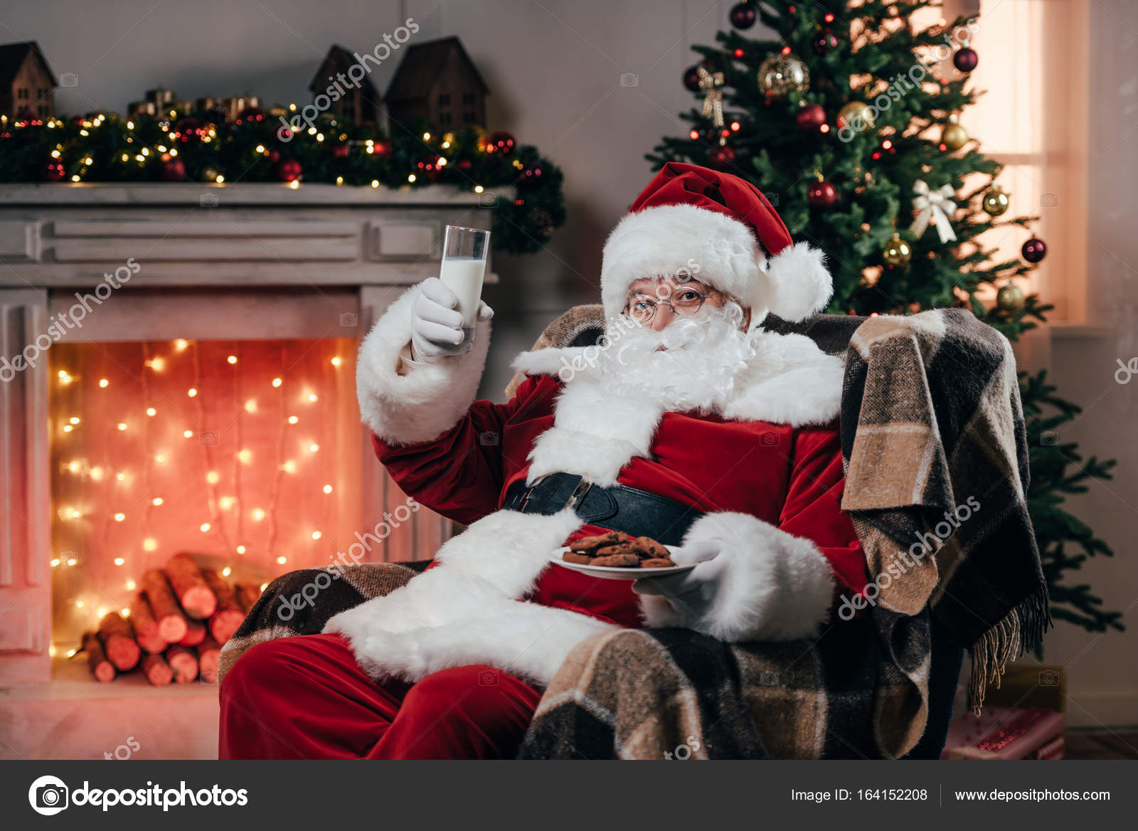 Santa with cookies and milk — Stock Photo © GeneGlavitsky 164152208