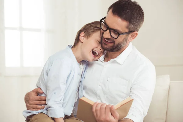 Father and son reading book — Stock Photo