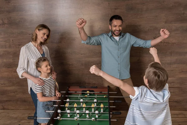 Family playing foosball together — Stock Photo