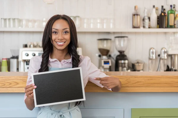 Waitress with empty board — Stock Photo