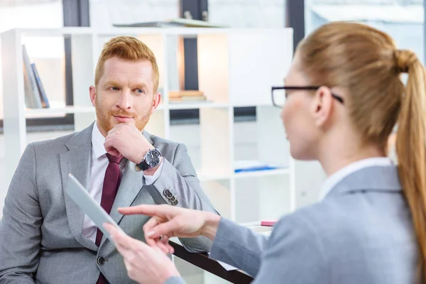 Businesspeople working with tablet — Stock Photo