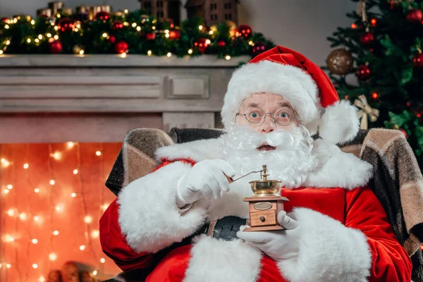 Santa claus with coffee grinder — Stock Photo