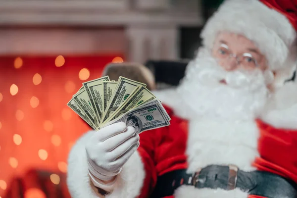 Santa with dollar banknotes — Stock Photo