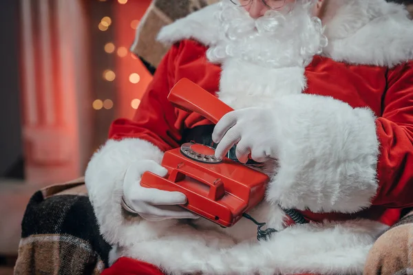 Santa with rotary telephone — Stock Photo