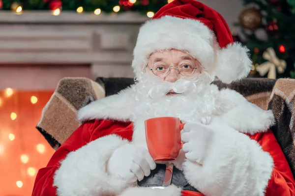 Santa drinking coffee — Stock Photo