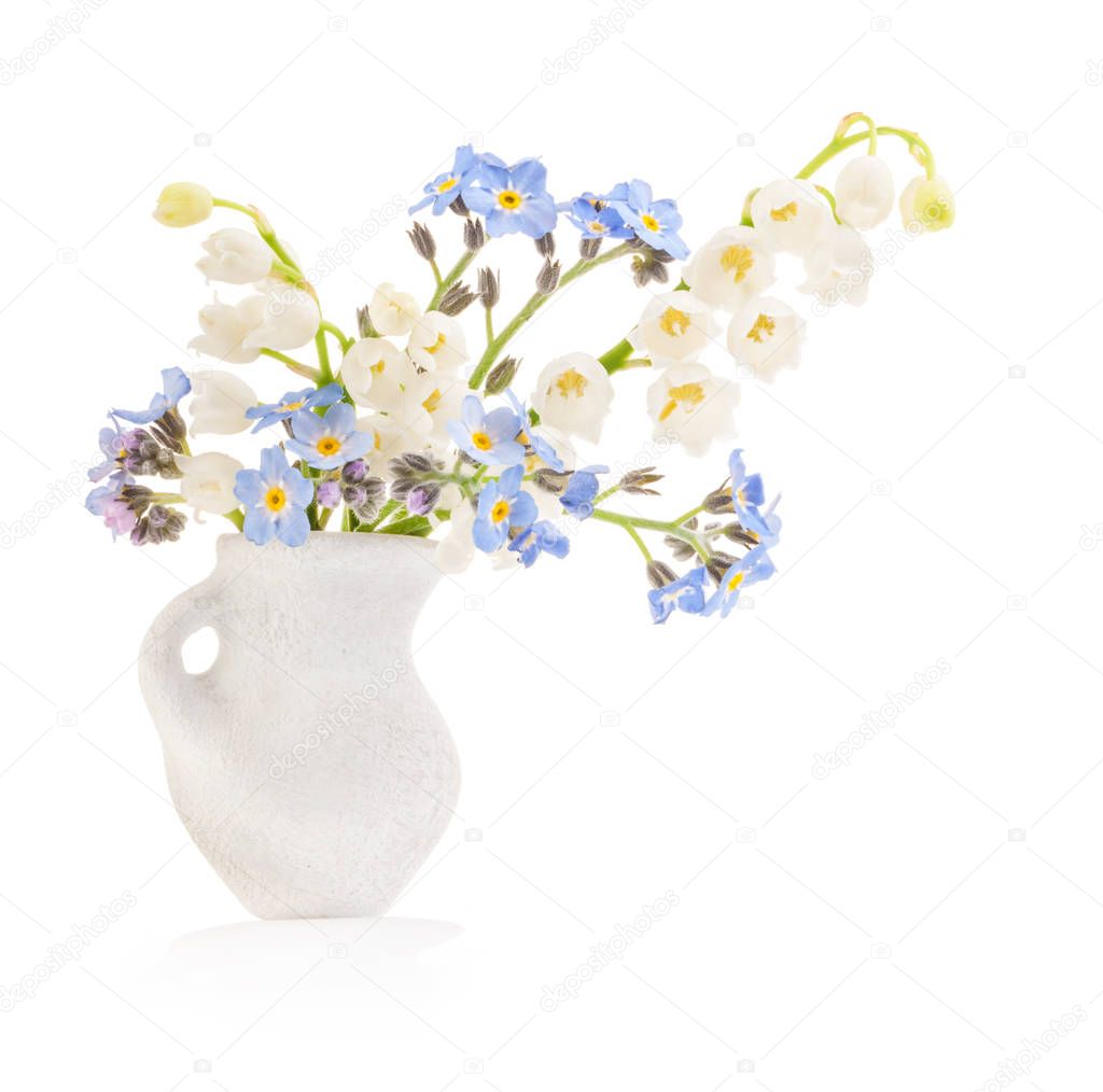 Spring flowers in white vase isolated on white