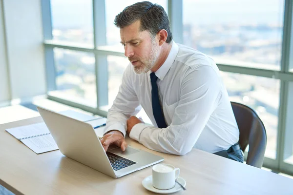 Mature Businessman Working Office Desk Typing His Laptop Serious Expression — Fotografia de Stock