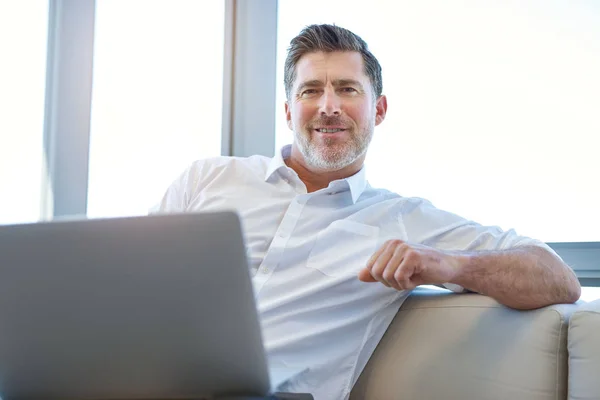 Portrait Mature Businessman Sitting Comfortably Laptop Computer His Lap Smiling — Zdjęcie stockowe