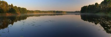 Panorama. Beautiful lake at dawn. clipart